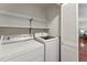 Convenient laundry room with washer, dryer, shelving, and easy access at 402 Abbott Dr, Sanford, NC 27330