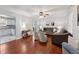 Bright living room with wood floors, ceiling fan, and modern furniture at 402 Abbott Dr, Sanford, NC 27330