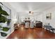 Bright living room with wood floors, ceiling fan, and modern furniture at 402 Abbott Dr, Sanford, NC 27330