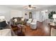 Comfortable living room with wood floors, ceiling fan, and modern furniture at 402 Abbott Dr, Sanford, NC 27330