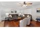Inviting living room featuring hardwood floors, neutral tones, and comfortable seating arrangements at 402 Abbott Dr, Sanford, NC 27330
