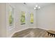 Bright dining area with three large windows and hardwood flooring at 42 Chris Todd Way, Angier, NC 27501