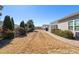Spacious backyard featuring a stone pathway and mature trees at 463 Kerriann Ln, Clayton, NC 27520
