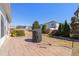 Open backyard with a grill on a paved patio and view of a trampoline and basketball hoop at 463 Kerriann Ln, Clayton, NC 27520