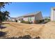 Wide backyard with mature trees, a patio, and a view of the home's rear exterior at 463 Kerriann Ln, Clayton, NC 27520