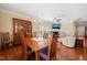 Open dining and living area with fireplace, hardwood floors, and stylish decor at 463 Kerriann Ln, Clayton, NC 27520