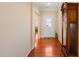 Warm and inviting entryway with gleaming hardwood floors and a decorative front door at 463 Kerriann Ln, Clayton, NC 27520