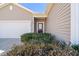 Inviting front entrance featuring a traditional-style door and meticulously maintained landscaping at 463 Kerriann Ln, Clayton, NC 27520