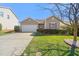 Charming single-story home with a well-manicured lawn, attached garage, and decorative shutter accents at 463 Kerriann Ln, Clayton, NC 27520