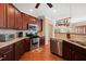 Well-equipped kitchen features stainless appliances, granite countertops, and hardwood floors at 463 Kerriann Ln, Clayton, NC 27520
