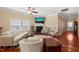 Cozy living room with a fireplace, comfortable seating, and natural light at 463 Kerriann Ln, Clayton, NC 27520