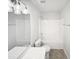 An efficient bathroom with a shower-tub combination and a sink at 4842 Wyatt Brook Way, Raleigh, NC 27609