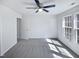 Bright bedroom with three windows, neutral paint, and plush carpeting at 4842 Wyatt Brook Way, Raleigh, NC 27609