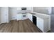 Eat-in kitchen with white cabinetry, stainless steel appliances, and modern countertops at 4842 Wyatt Brook Way, Raleigh, NC 27609