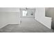 Bright living room featuring neutral paint, plush carpet, and abundant natural light from the double windows at 4842 Wyatt Brook Way, Raleigh, NC 27609