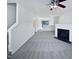 Bright living room with a fireplace and modern ceiling fan, creating a welcoming space at 4842 Wyatt Brook Way, Raleigh, NC 27609