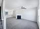 Open living room featuring a fireplace and access to the kitchen at 4842 Wyatt Brook Way, Raleigh, NC 27609