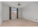 Bright bedroom featuring neutral walls, carpet flooring, a window, and a ceiling fan at 534 Ives Ct, Chapel Hill, NC 27514
