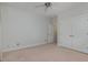 Neutral bedroom featuring plush carpeting, ceiling fan, and double-door closet at 534 Ives Ct, Chapel Hill, NC 27514