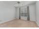 Bright bedroom boasts a window with curtains and plush carpeting at 534 Ives Ct, Chapel Hill, NC 27514