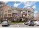 Inviting exterior of a multi-story apartment building with manicured landscaping and ample parking at 534 Ives Ct, Chapel Hill, NC 27514