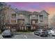 Exterior view of the building with multiple balconies and a parking area at 534 Ives Ct, Chapel Hill, NC 27514