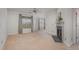 Bright living room featuring neutral walls, carpet flooring, fireplace, and large windows at 534 Ives Ct, Chapel Hill, NC 27514