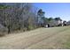 This backyard features a shed and mature trees, offering plenty of space for outdoor activities at 5421 Downton Grove Ct, Fuquay Varina, NC 27526
