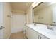 Bathroom with double vanity, large mirror, and combination tub and shower at 5421 Downton Grove Ct, Fuquay Varina, NC 27526