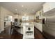 Bright kitchen featuring white cabinets, granite countertops, and stainless steel appliances at 5421 Downton Grove Ct, Fuquay Varina, NC 27526