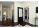 Open-concept living room showing the front door with black frame and brick exterior at 5421 Downton Grove Ct, Fuquay Varina, NC 27526