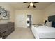 A bright primary bedroom with a ceiling fan, and dresser at 5421 Downton Grove Ct, Fuquay Varina, NC 27526