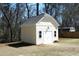 Charming storage shed with windows and a double door, providing extra storage space at 5421 Downton Grove Ct, Fuquay Varina, NC 27526