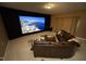 Home theater with projector screen, comfortable seating, and ambient lighting for entertainment at 5421 Downton Grove Ct, Fuquay Varina, NC 27526