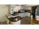 Eat-in kitchen bar with seating for two, with open access to the adjacent kitchen and dining area at 55 Waters Edge Loop, Henderson, NC 27537