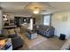 Living room featuring hardwood floors, tv, sofa, and natural light at 55 Waters Edge Loop, Henderson, NC 27537