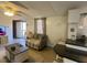 Living room featuring a sofa, hardwood floors, and natural light at 55 Waters Edge Loop, Henderson, NC 27537