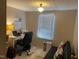 Bright office space featuring a window, desk, and comfortable rolling chair at 55 Waters Edge Loop, Henderson, NC 27537