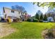 Large green backyard with deck and patio areas at 604 Trunecek Cir, Raleigh, NC 27603