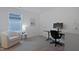 Cozy bedroom features ample workspace, a neutral color scheme, and natural light at 662 Vine Pkwy, Pittsboro, NC 27312