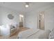 Airy bedroom features an adjacent bathroom and doorway leading to an additional bedroom at 662 Vine Pkwy, Pittsboro, NC 27312