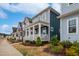 View of neighborhood with craftsman-style homes and landscaped front yards, creating a welcoming curb appeal at 662 Vine Pkwy, Pittsboro, NC 27312