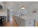 Spacious kitchen with an island, stainless steel appliances, and an open layout at 662 Vine Pkwy, Pittsboro, NC 27312