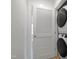 The laundry room features a stacked washer and dryer, all within a clean and organized space at 662 Vine Pkwy, Pittsboro, NC 27312