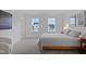 Bright main bedroom with carpet, large windows, soft colors, and modern accents at 662 Vine Pkwy, Pittsboro, NC 27312