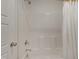An all-white shower unit and door creates a clean and classic design at 662 Vine Pkwy, Pittsboro, NC 27312