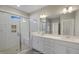 Modern bathroom with a glass-enclosed shower, white subway tile, and dual sink vanity, creating a spa-like retreat at 69 Alex Farm Ct # 21, Zebulon, NC 27597