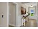 Inviting foyer with wood floors, an entry table, art on the wall, and a view of the front door at 69 Alex Farm Ct # 21, Zebulon, NC 27597
