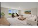 Spacious living room with ample natural light, comfortable seating, and stylish decor at 69 Alex Farm Ct # 21, Zebulon, NC 27597