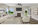 Inviting living room with a fireplace, comfortable seating, large windows, and access to the backyard at 69 Alex Farm Ct # 21, Zebulon, NC 27597
